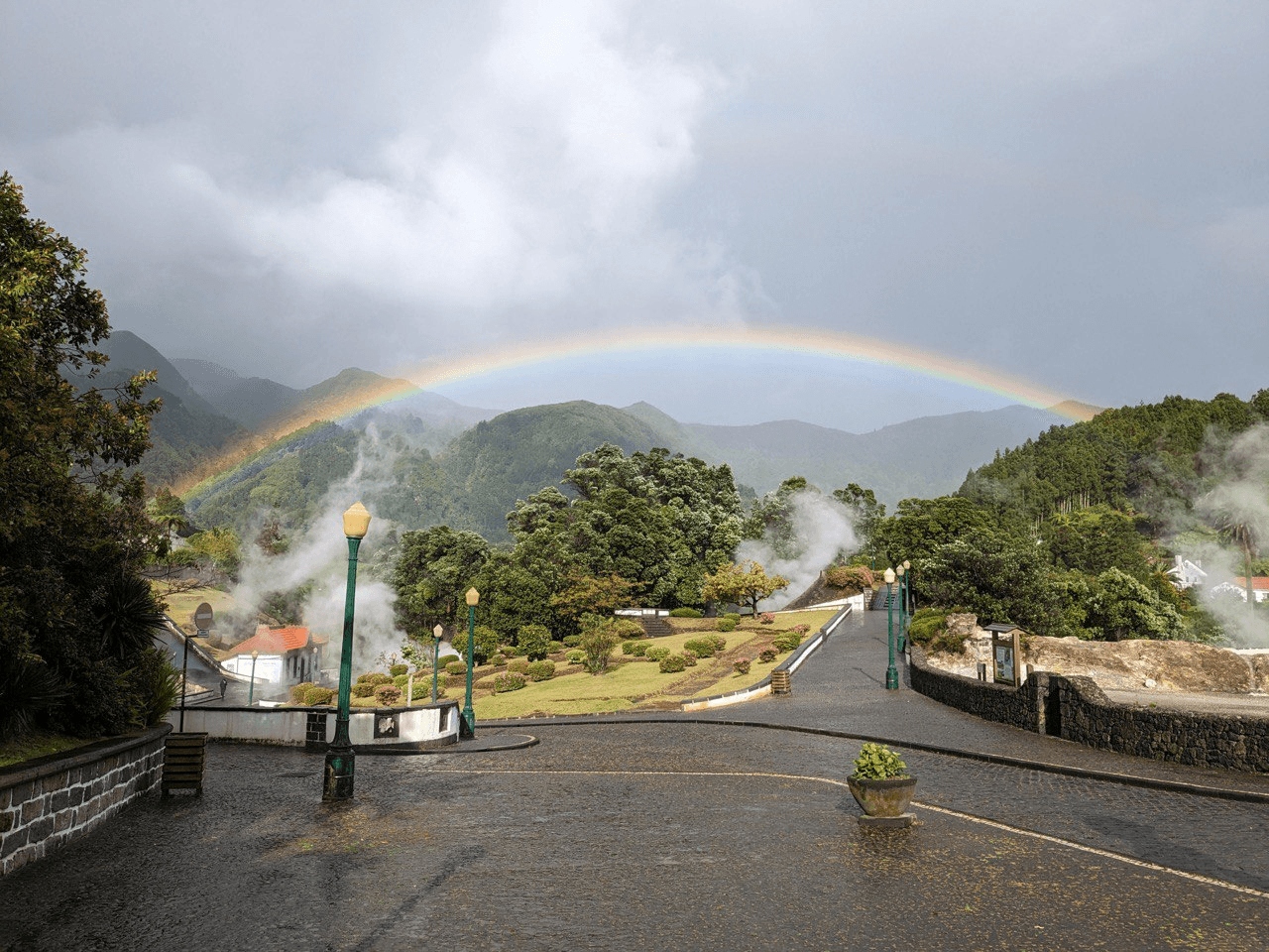 Rainbow over the Furnas crater with geothermal steam